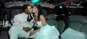 Beautiful couple kissing and hugging inside the limousine on a leather seat.