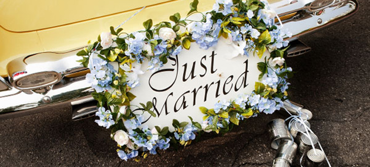 Just married sign on a back of a limousine